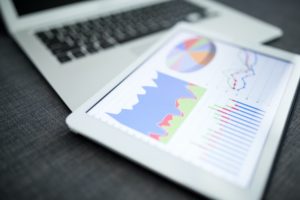 Business charts and diagrams on digital tablet